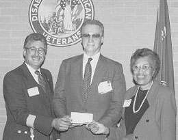 George Burk receiving recognition award